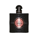 A bottle of Black Opium Eau de Parfum by Yves Saint Laurent with a black sparkling design and a gold label.