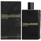A black bottle of 'Just Rock! for Him' Eau de Toilette by Zadig & Voltaire with a gold cap and label, alongside its packaging box with the product name displayed.